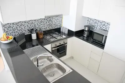 a kitchen with a sink and a stove at Luxury Dubai High Rise, Skyline Views in Dubai