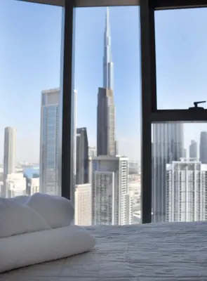 a bedroom with a view of a city skyline at Luxury Dubai High Rise, Skyline Views in Dubai