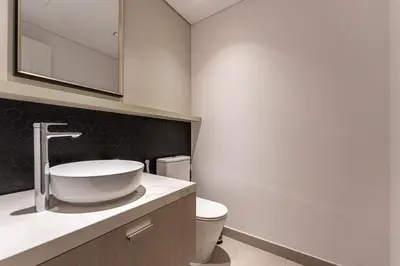 a bathroom with a sink and a toilet at HAVN - 1 Bedroom in Harrington House, JVC in Dubai