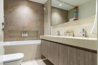 a bathroom with a sink and a toilet at downtown views 1108 burj in Dubai