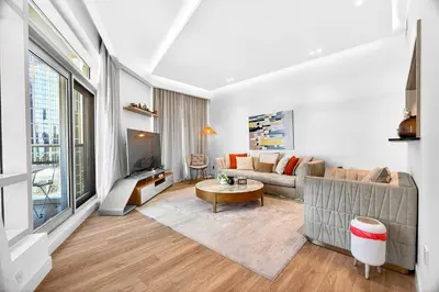 a living room with a couch and a table at Trendy 2BR Direct Mall Access Burj View High Floor in Dubai