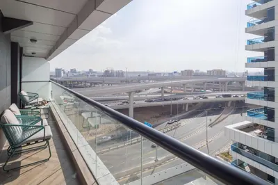 a balcony with a view of a highway at Frank Porter - Escan Tower in Dubai