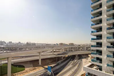 an overhead view of a highway with train tracks at Frank Porter - Escan Tower in Dubai