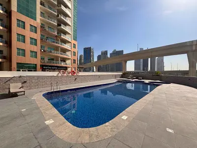 a swimming pool in the middle of a building at Frank Porter - Escan Tower in Dubai