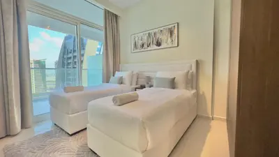 a hotel room with two beds and a large window at Sleek & Spacious 2BR in DAMAC Vera, Business Bay by Bhavan Vacation Homes in Dubai