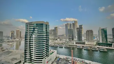 a view of a city with a river and buildings at Sleek & Spacious 2BR in DAMAC Vera, Business Bay by Bhavan Vacation Homes in Dubai