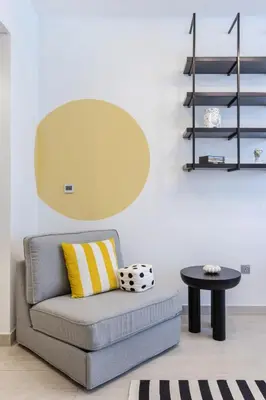 a living room with a couch and a table at Modern Boutique Studio with Burj Khalifa View in Dubai