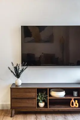 a flat screen tv sitting on top of a wooden entertainment center at Stunning Hideaway in Dubai Marina in Dubai