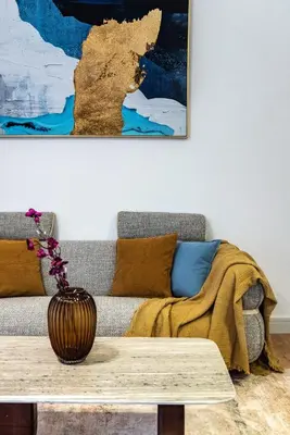 a living room with a couch and a table at Stunning Hideaway in Dubai Marina in Dubai