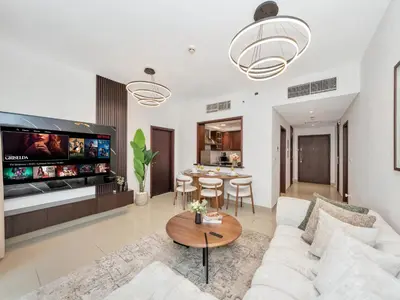 a living room with a couch and a table at Royal Vista - Luxury 3BR Apartment at 29 Boulevard Tower - Downtown in Dubai