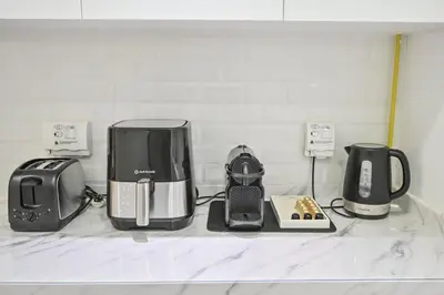 a group of appliances sitting on top of a counter at Azure Residences a Beachfront Getaway on Palm Jumeirah in Dubai