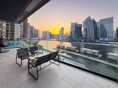 a balcony with a view of a city skyline at Sunset View Overlooking Burj Khalifa and Canal View in Dubai