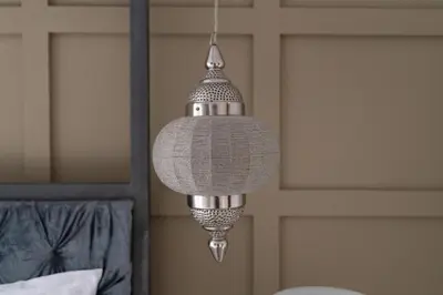 a silver chandelier hanging in a bedroom at White Sage Spacious 1BR at Marina Promenade in Dubai