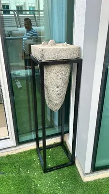a stone bird feeder on the side of a building at Usmans Brand New Duplex Apartment 5 Bedrooms Dubai Marina Trident Bayside 4 Rooms with 4 En-suite Washrooms in Dubai
