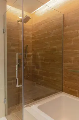 a shower with a glass door in a bathroom at 2BDR Apartment in Bluewaters Luxury Area in Dubai