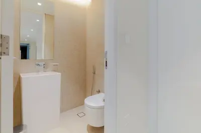 a bathroom with a toilet and a mirror at 2BDR Apartment in Bluewaters Luxury Area in Dubai