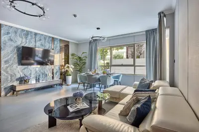 a living room with a couch and a table at Frank Porter - Marina Quays East Tower in Dubai