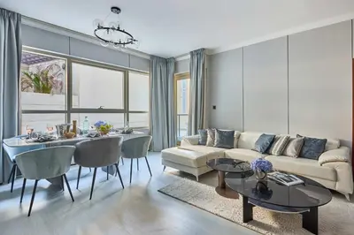 a living room with a couch and a dining room at Frank Porter - Marina Quays East Tower in Dubai