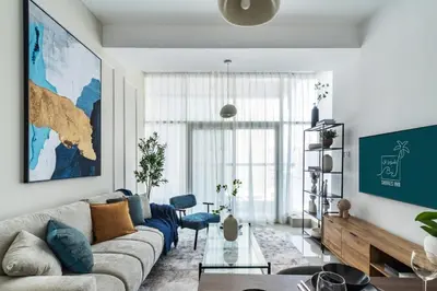a living room with a couch and a table at ShoresInn - A sublime stay in Dubai Marina in Dubai