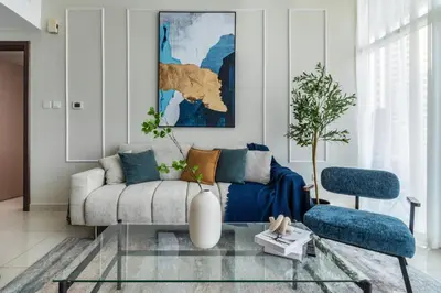 a living room with a couch and a glass table at ShoresInn - A sublime stay in Dubai Marina in Dubai