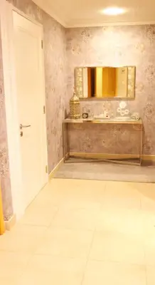 a bathroom with a sink and a mirror at Luxury Apartment by oima leasing property in Dubai