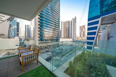 a balcony with a view of a city at Charm Studio Fully Furnished with Style in Dubai