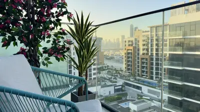 a balcony with a view of a city at Studio next Dubai Mall with pool in Dubai