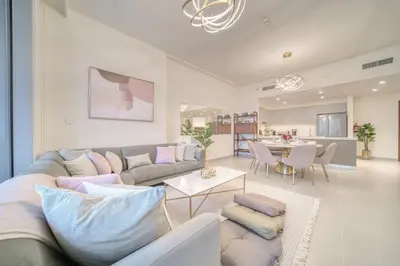 a living room with a couch and a table at Forte 2, Downtown Dubai - Mint Stay in Dubai