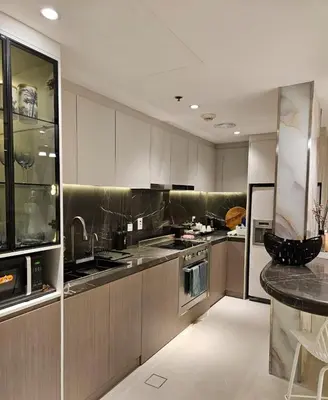 a kitchen with stainless steel appliances and a counter at Marina View Tower A in Dubai