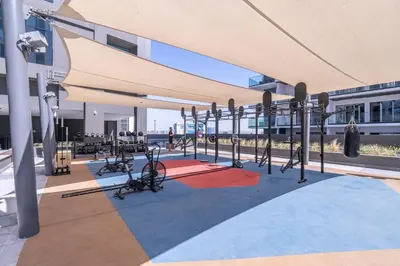 a fitness center with a bunch of exercise equipment at Luxury Apartment with Burj Khalifa View, Balcony Netflix WeHome Premium in Dubai