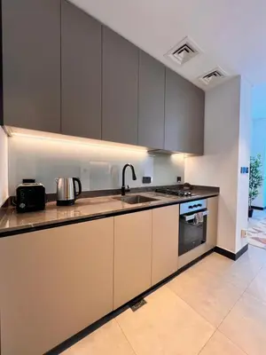 a kitchen with a sink and a counter top at Gennaro's Home at 15 Northside Business Bay in Dubai