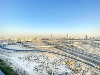 an aerial view of a snowy city with buildings at Locations I Binghatti Luna - JVC I Modern 1BR Apartment I Upgraded Interiors & Comfortable Stay I Scenic Community & Skyline Views in Dubai