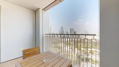 a balcony with a wooden bench and a view of a city at Vacationer l High Rise 1 Bedroom l Close to Dubai Mall l Pool Access with Burj Khalifa Views in Dubai