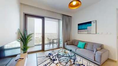 a living room with a couch and a large window at Vacationer l High Rise 1 Bedroom l Close to Dubai Mall l Pool Access with Burj Khalifa Views in Dubai