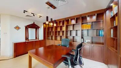 a office with a wooden desk and two chairs at Vacationer I Lux 3 Bedroom Apartment I Steps from Barasti Beach in Dubai
