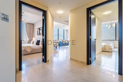 a hallway leading to a bedroom with a bed at Delightful 2BR at Sky Gardens DIFC by Deluxe Holiday Homes in Dubai