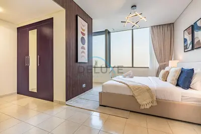 a bedroom with a large bed and a large window at Delightful 2BR at Sky Gardens DIFC by Deluxe Holiday Homes in Dubai