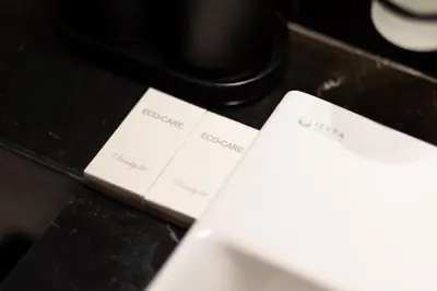 a close up of a computer keyboard with cards on it at Bright 1BR with balcony in Binghatti Corner in Dubai