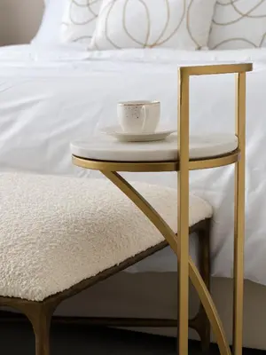 a table and a chair with a cup on it at La Vie JBR Beatiful 1 Bed Seafront in Dubai