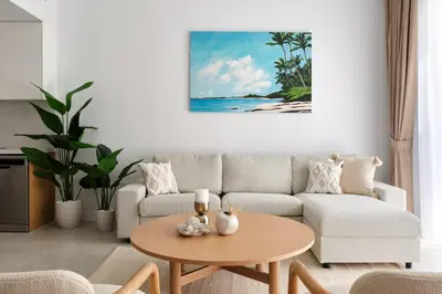 a living room with a couch and a table at La Vie JBR Beatiful 1 Bed Seafront in Dubai