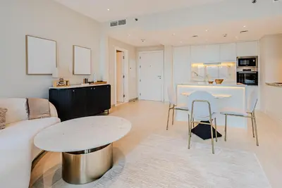 a living room with a couch and a table at Breathtaking 1BDR Apartment in Dubai Marina I Bonair I Park Islands in Dubai