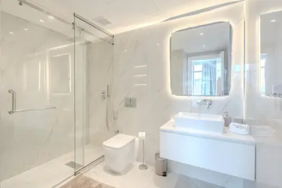 a bathroom with a shower and a toilet and a sink at Breathtaking 1BDR Apartment in Dubai Marina I Bonair I Park Islands in Dubai