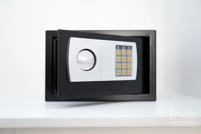 a microwave oven on a white wall at Luxury Studio in DAMAC Hills with Premium Amenities in Dubai
