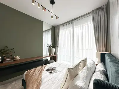 a bedroom with a bed and a couch at Trophy Luxury Stellar Sky Suites in JVC with Great Views in Dubai