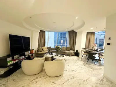 a living room with a couch and a table at Modern & Bright Canal View 2BR Near Dubai Mall by Vibel in Dubai