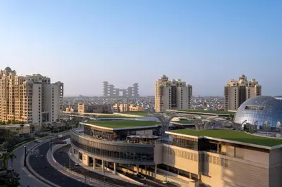 a view of a building in a city with tall buildings at Charming Studio in Seven Palm with Balcony Rooftop Floor in Dubai