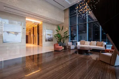 a lobby with a couch and chairs and a table at Downtown Apartment Studio near Burj Khalifa in Dubai