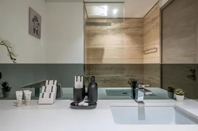 a bathroom with a sink and a counter top at Downtown Apartment Studio near Burj Khalifa in Dubai