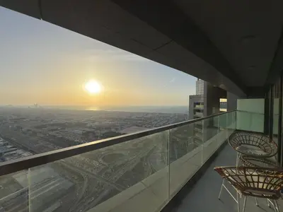 a view from the top of a building with two chairs at Cozy 2BR in Business Bay, Aykon Tower in Dubai