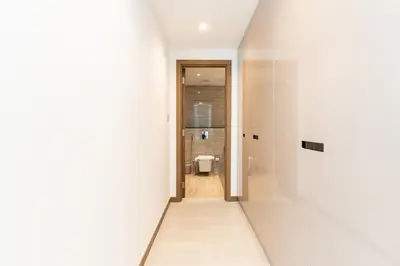 a hallway with a toilet in a white room at DAYF-DAN Missoni Apartment with Private Lift in Business Bay in Dubai